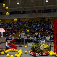 Yellow balls fly through the air during the 2026 GVSU West Michigan District Event
